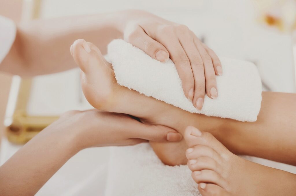 Beautiful Clean Female Legs in Spa Composition.